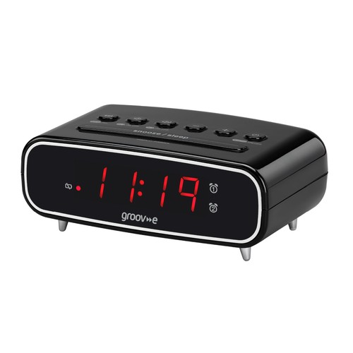 Digital alarm clock with - , fm